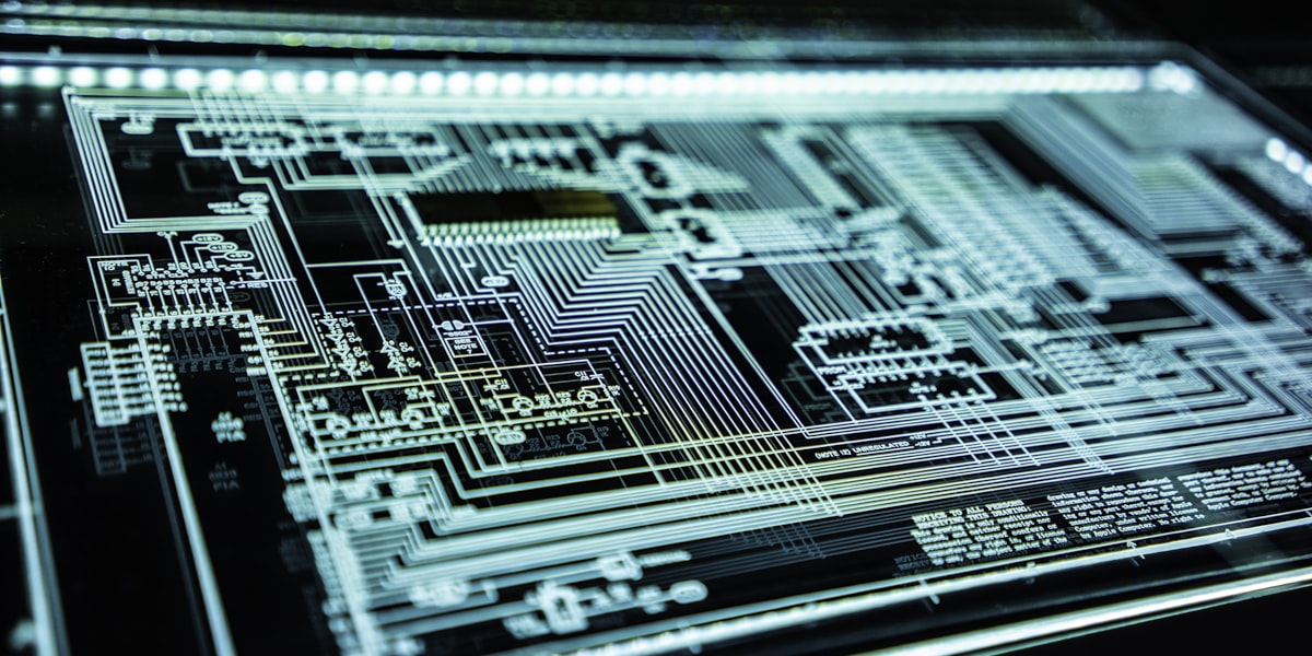 A glowing circuit schematic on a dark surface