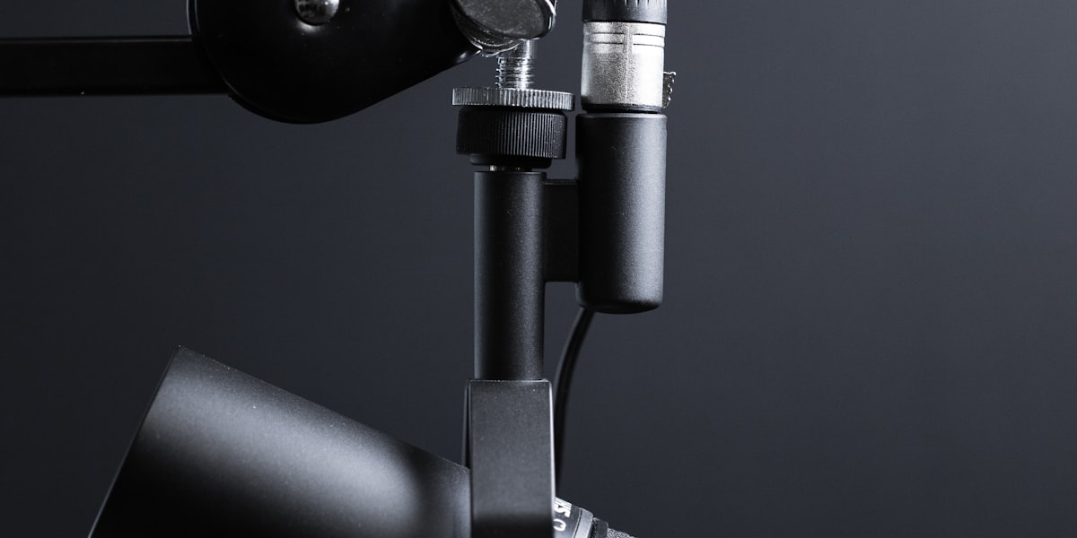 A professional studio microphone on a boom arm